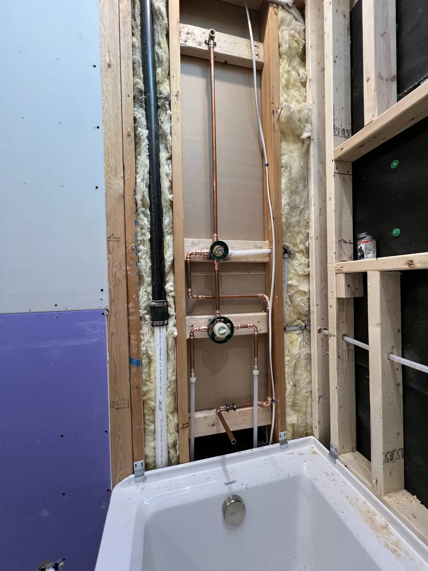 Bathroom rough in with copper supply lines and a new shower base in a Pittsburgh area basement