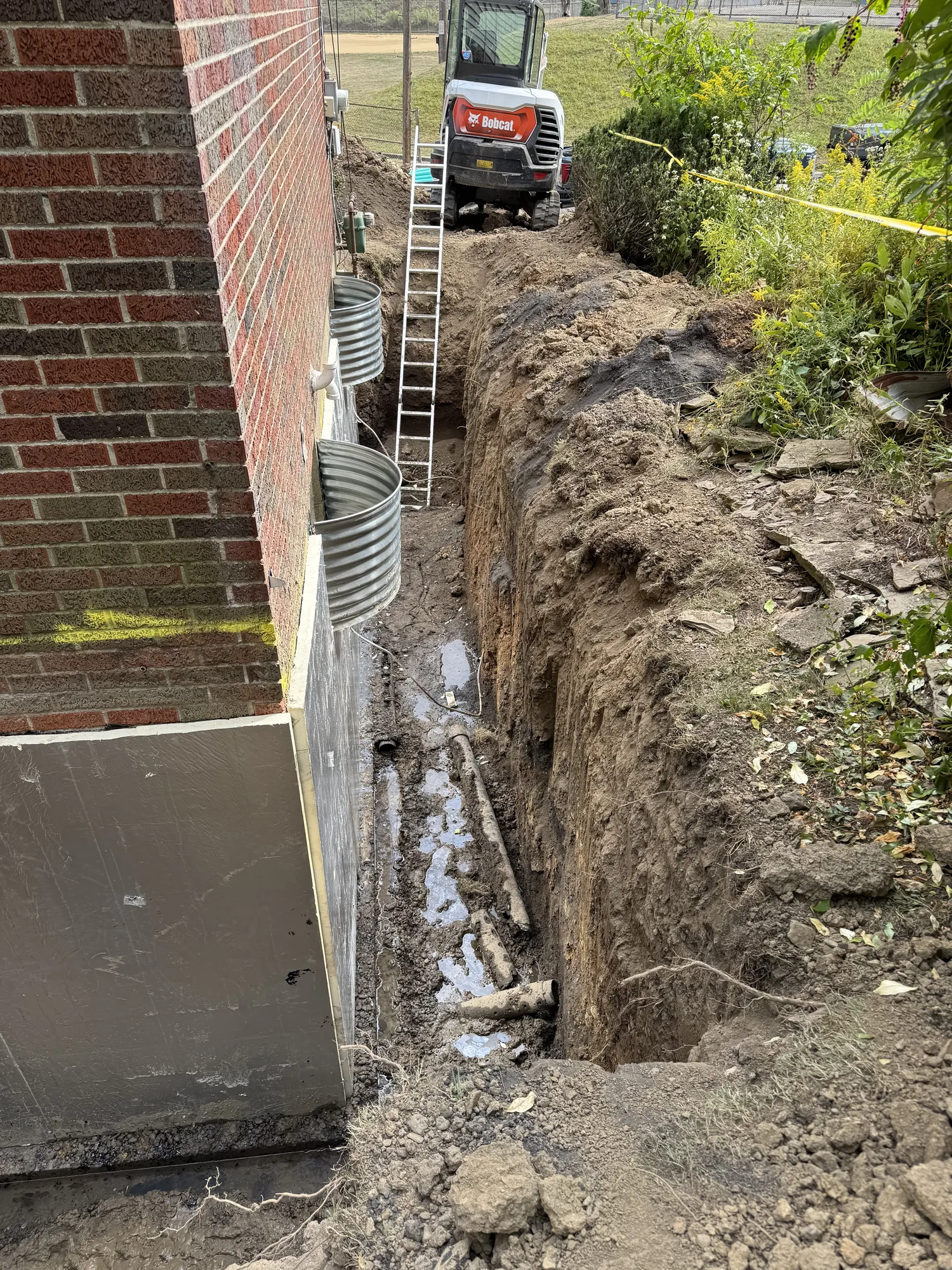 Foundation excavation for exterior drainage at a Pittsburgh area home