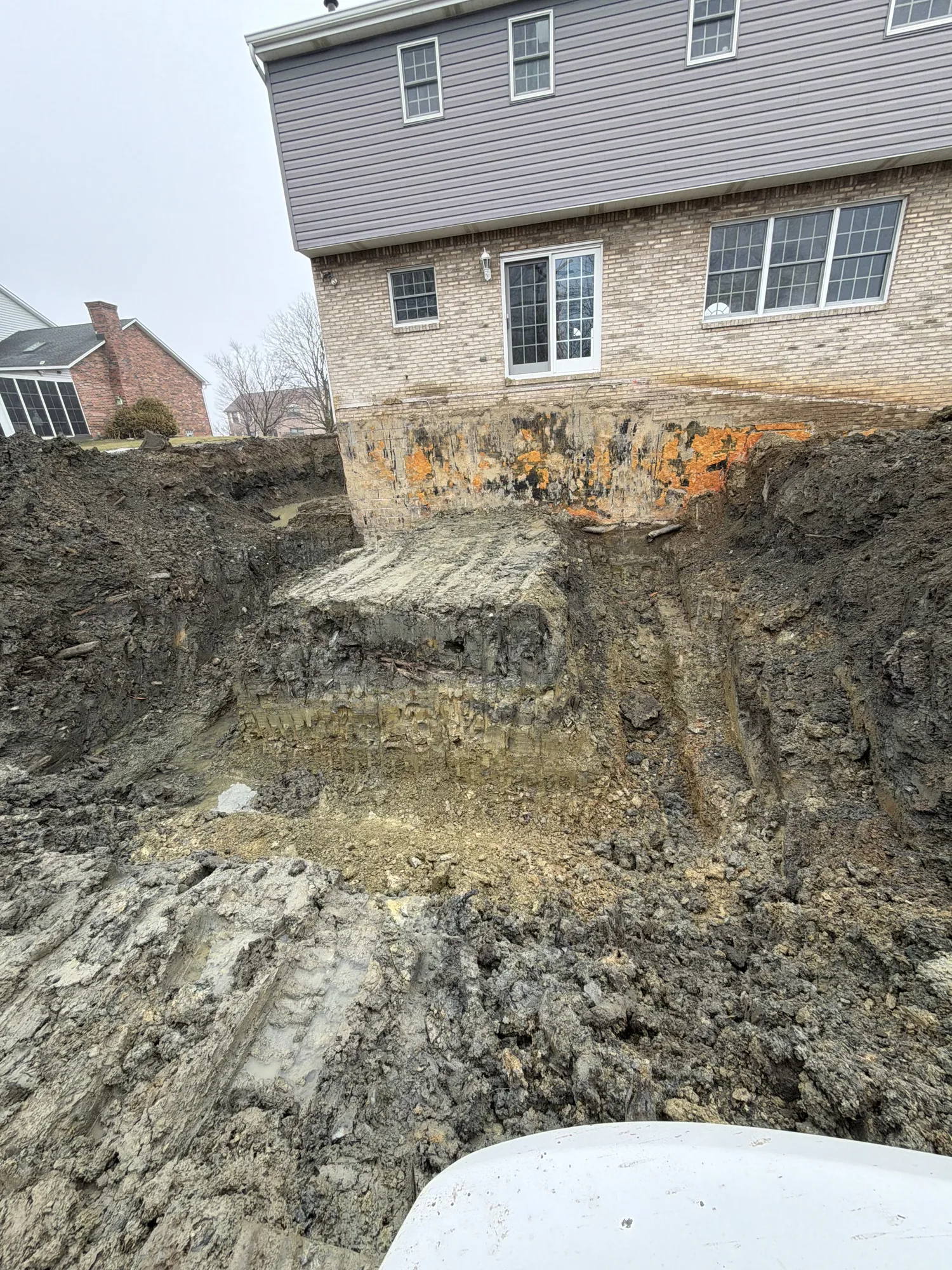Large site excavation and earthmoving beside a building in the Pittsburgh North Hills