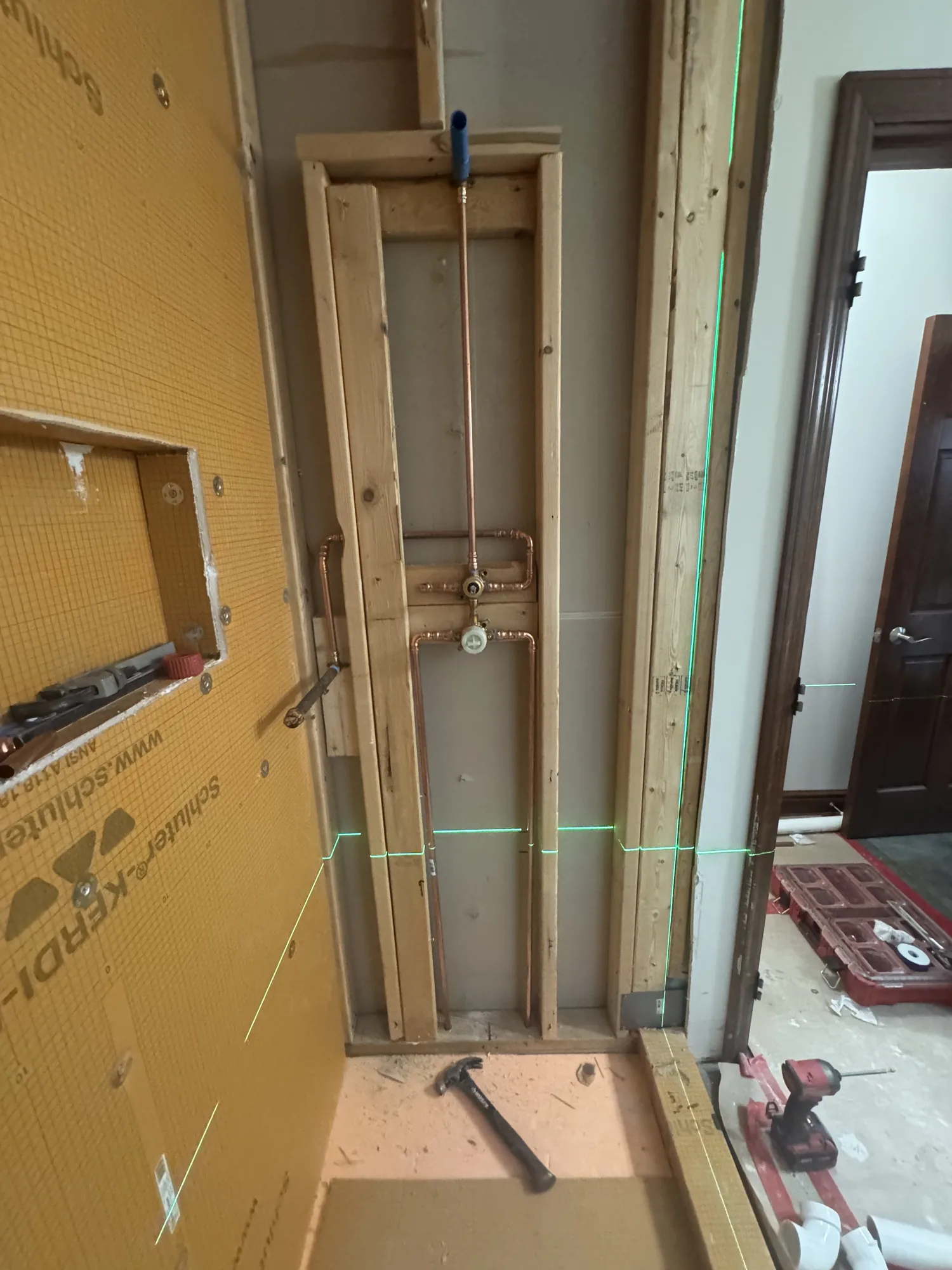 Shower wall waterproofing board and copper valve rough in during a Pittsburgh bathroom remodel