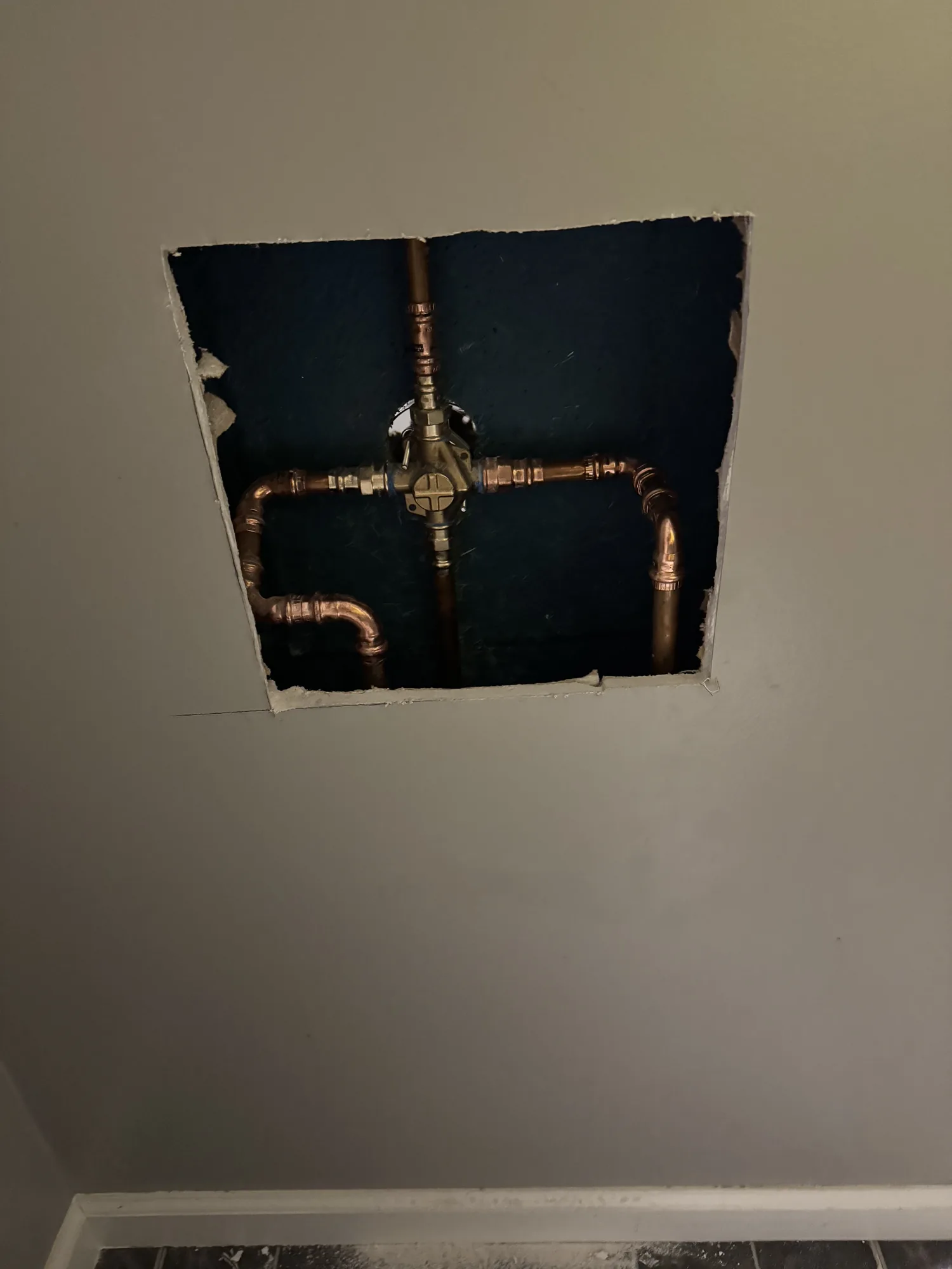 Interior wall opened to reach a gas valve and copper lines during a Pittsburgh service call