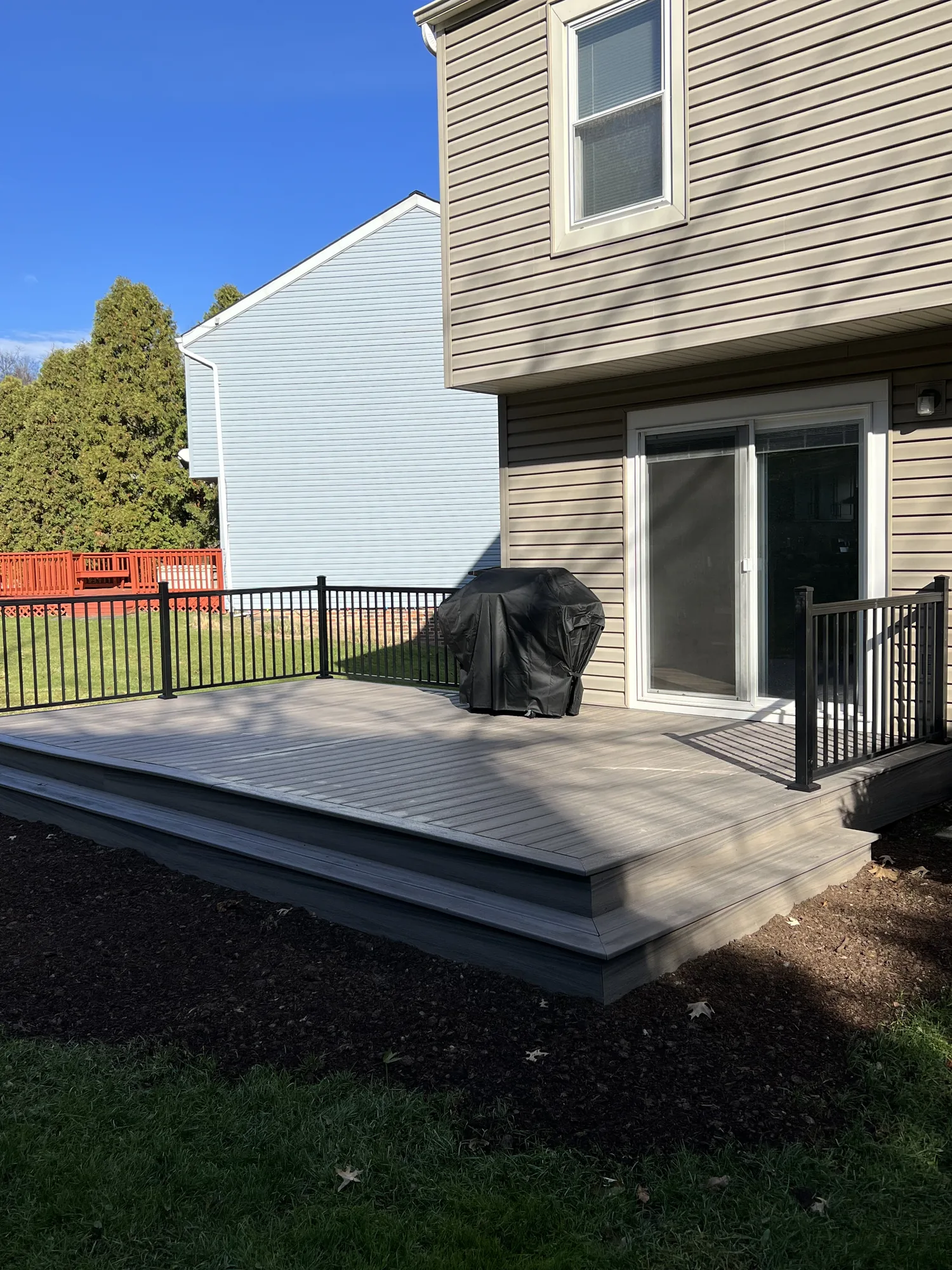 Composite deck with black aluminum railing on a townhome in the Pittsburgh North Hills