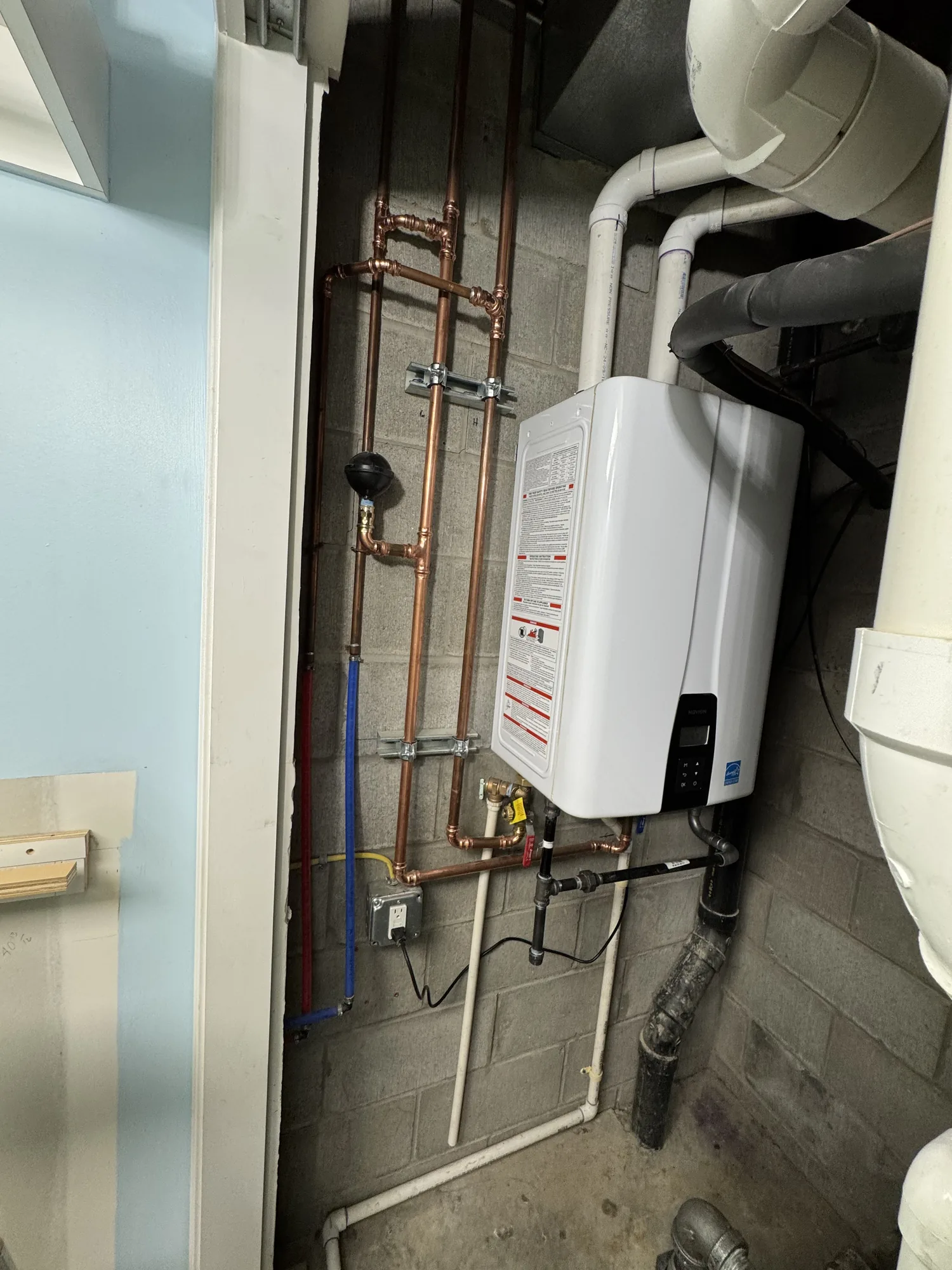 New copper water service piping with expansion tank on a basement wall in Allison Park