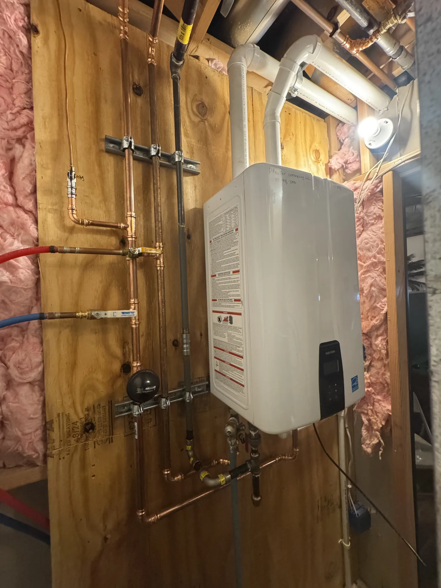 Wall mounted boiler with copper and gas line piping in a Pittsburgh basement mechanical room