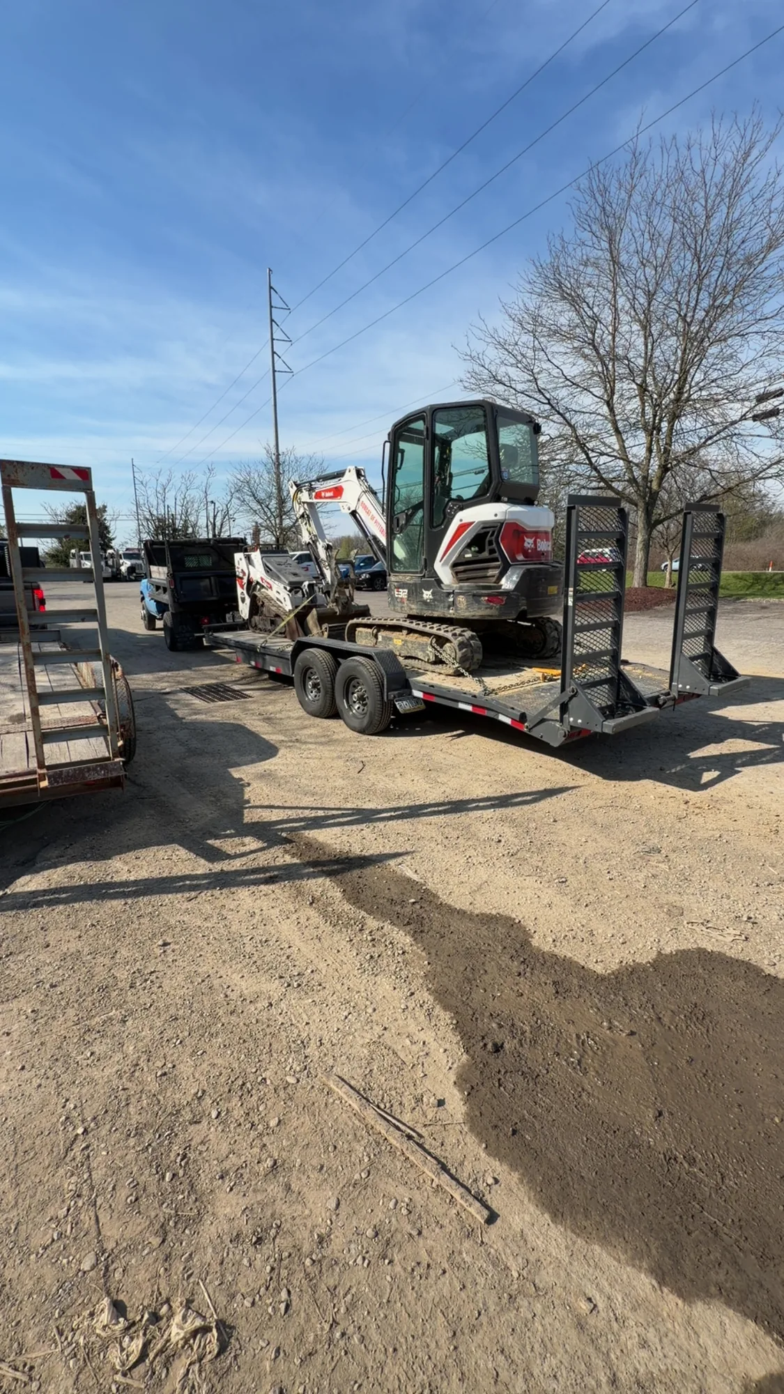 Mini excavator loaded on a trailer ready for an excavation job in Allison Park